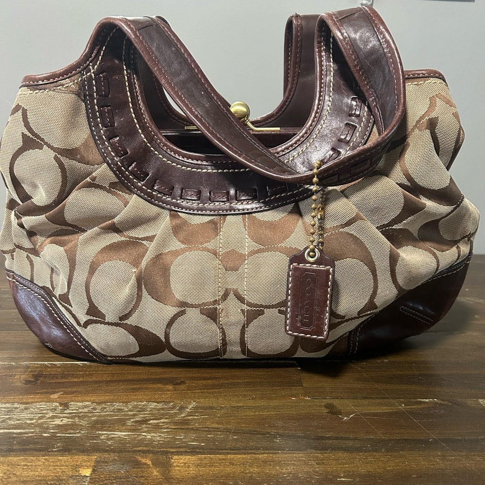 Brown coach purse, slight staining pictured but still in good condition.